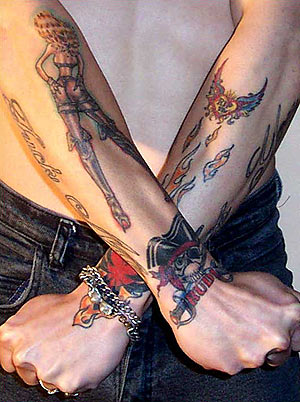 skin rip tattoos. chick, pirate / flames, rip,